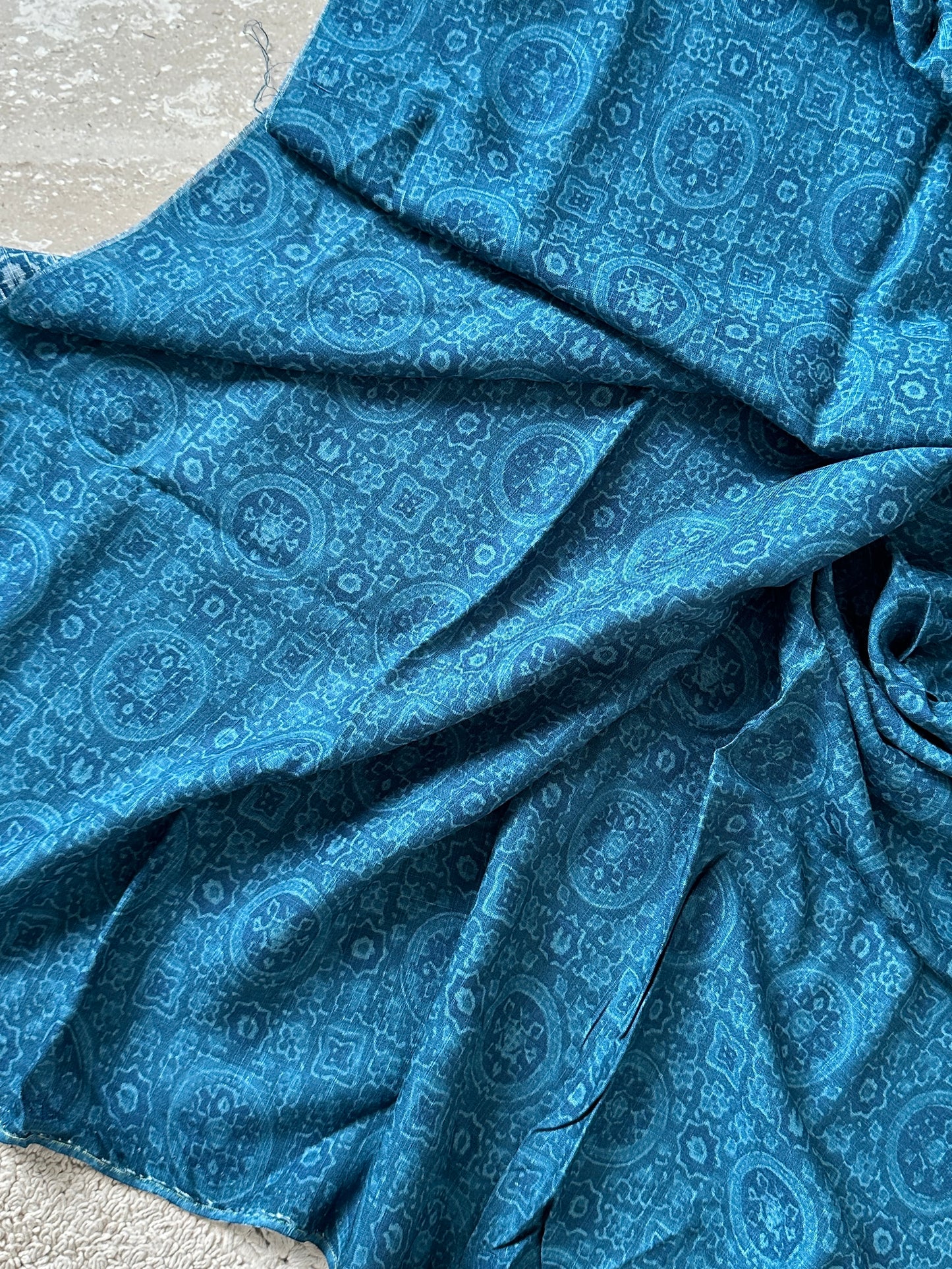 teal-blue-ethnic-motif-printed-cotton-fabric 1