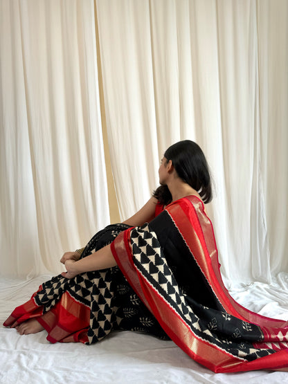 Black saree with red border 