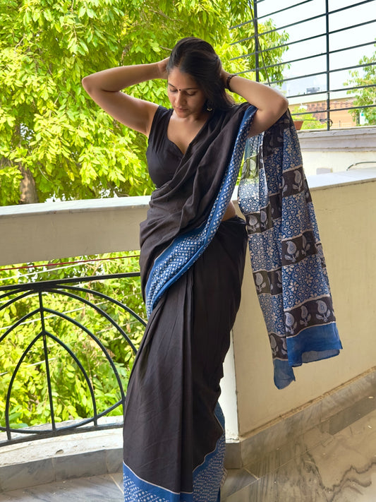 Black cotton block printed saree with blue border