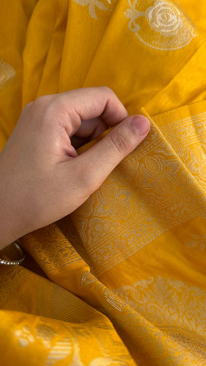 Bright yellow silk saree