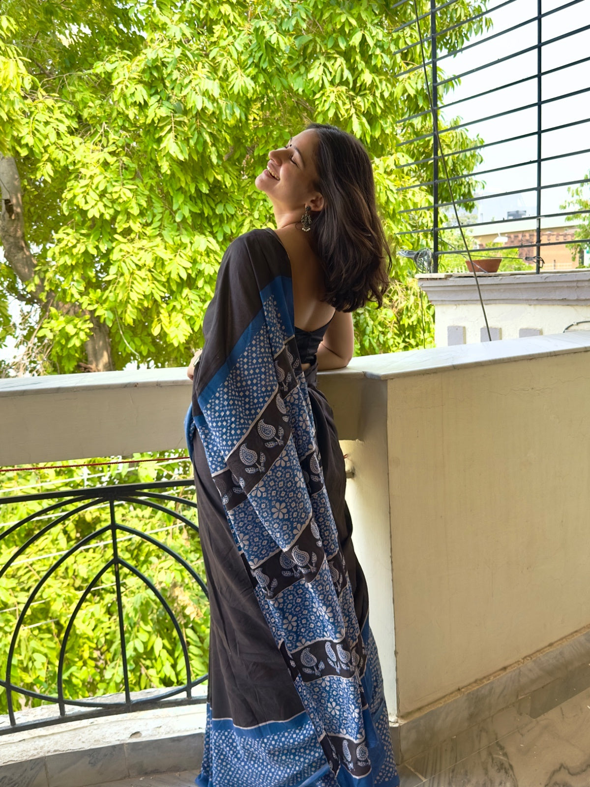 Elegant black saree with contrast blue border in cotton