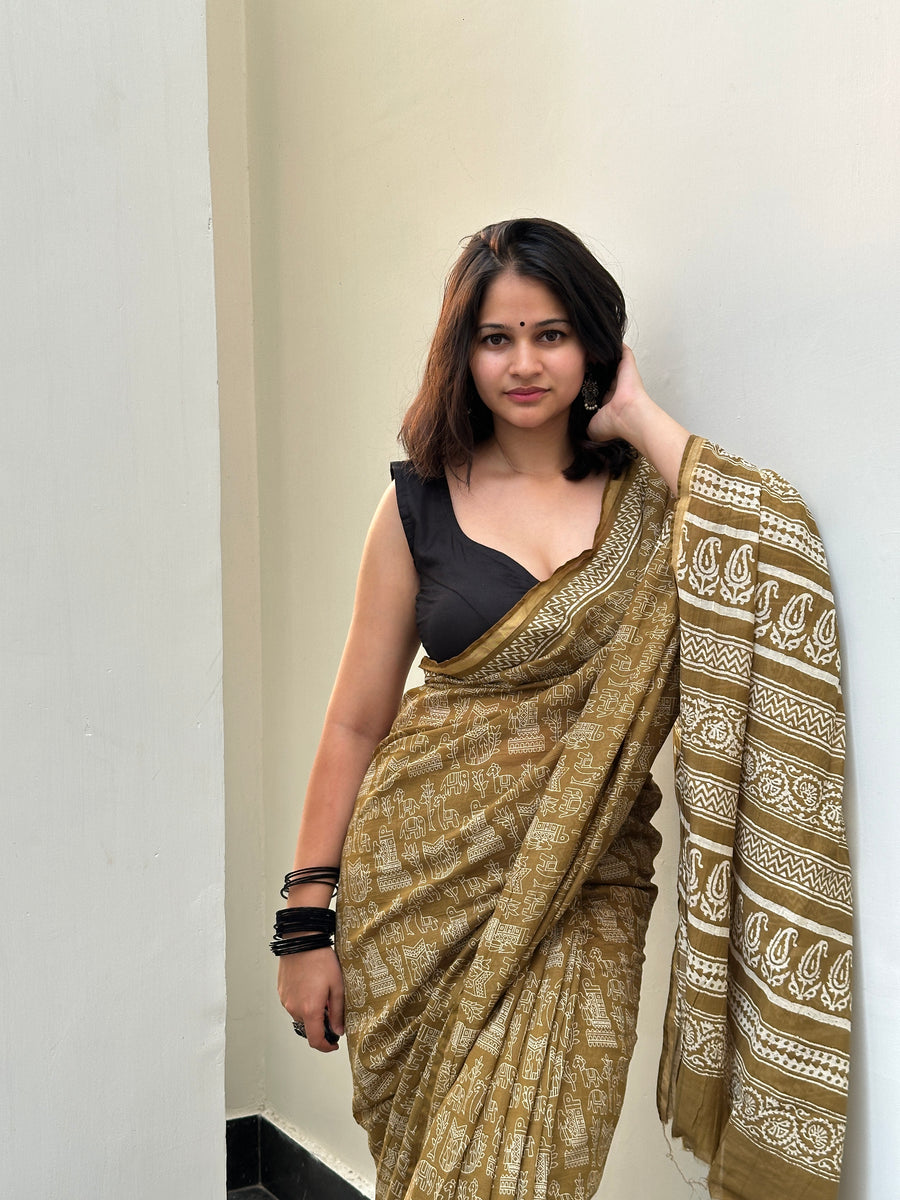 Olive green saree with elephant motifs