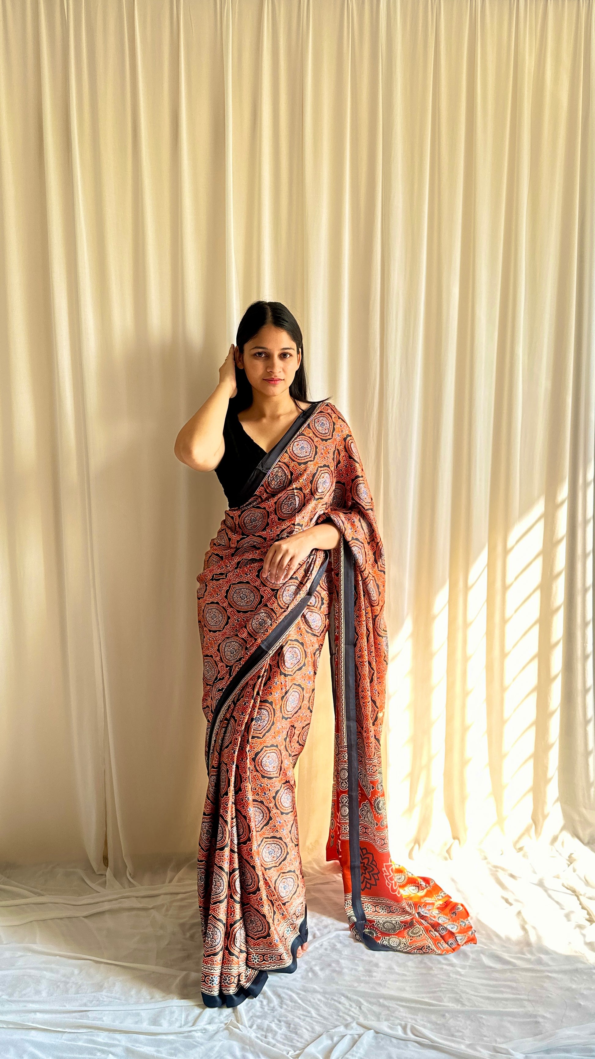 Orange Ajrakh print saree