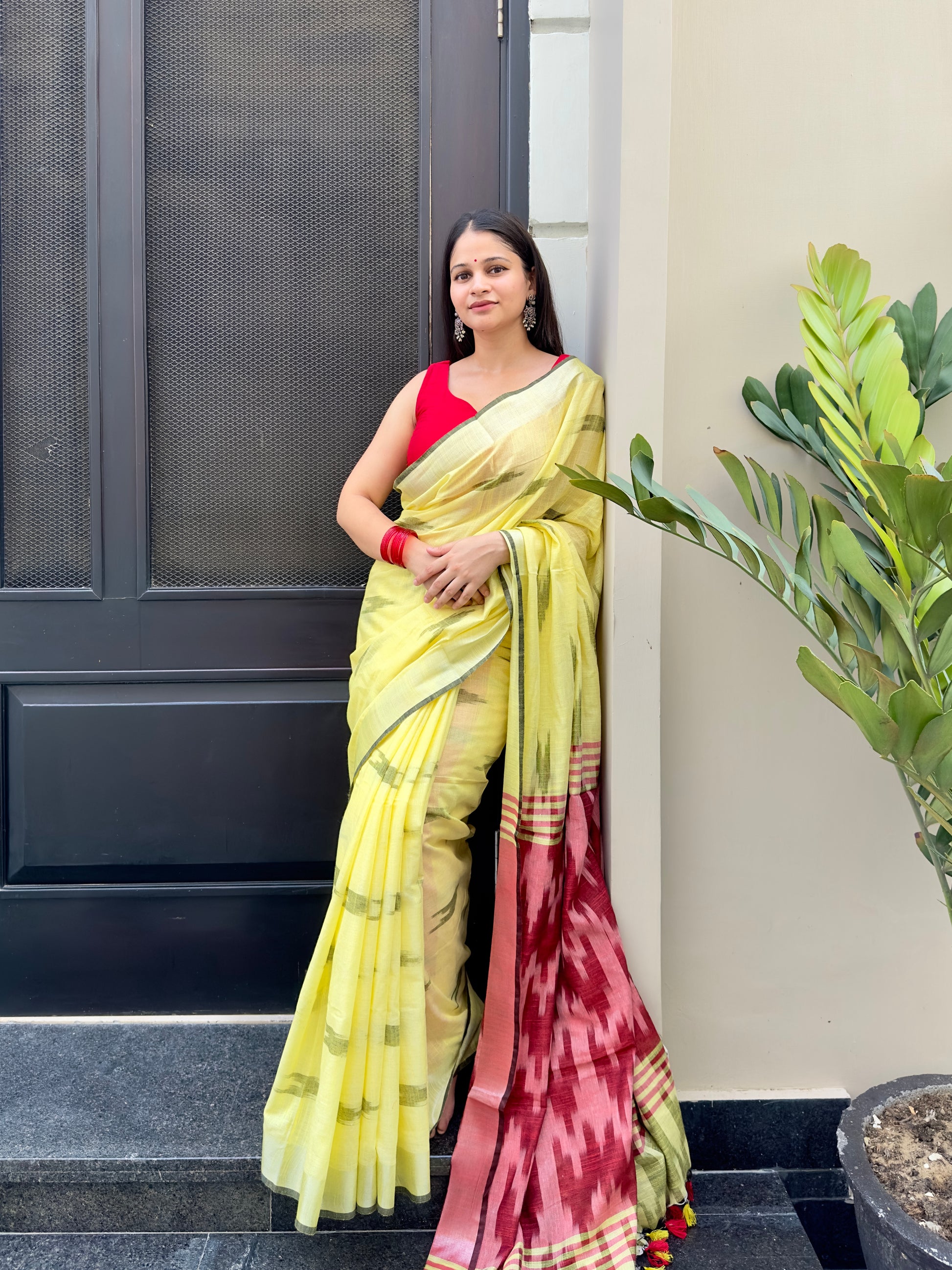 Yellow saree with red pallu